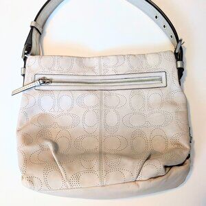 Genuine Coach bag featuring perforated "C" signature logo pattern on the leather